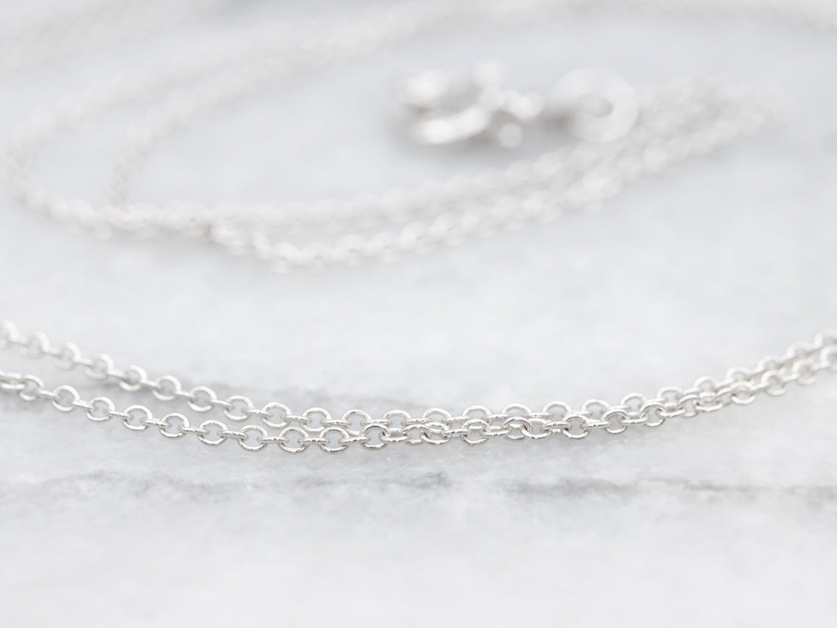 Modern Sapphire and Diamond Halo Pendant Necklace