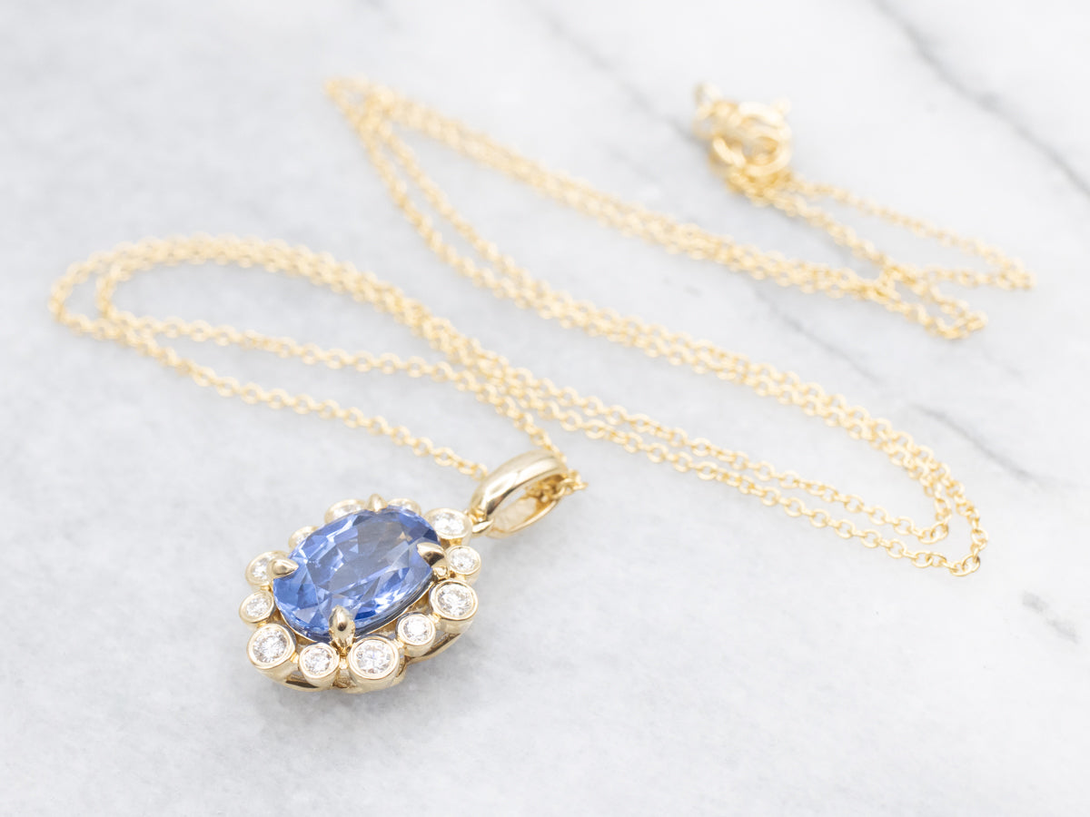 Modern Sapphire and Diamond Halo Pendant Necklace