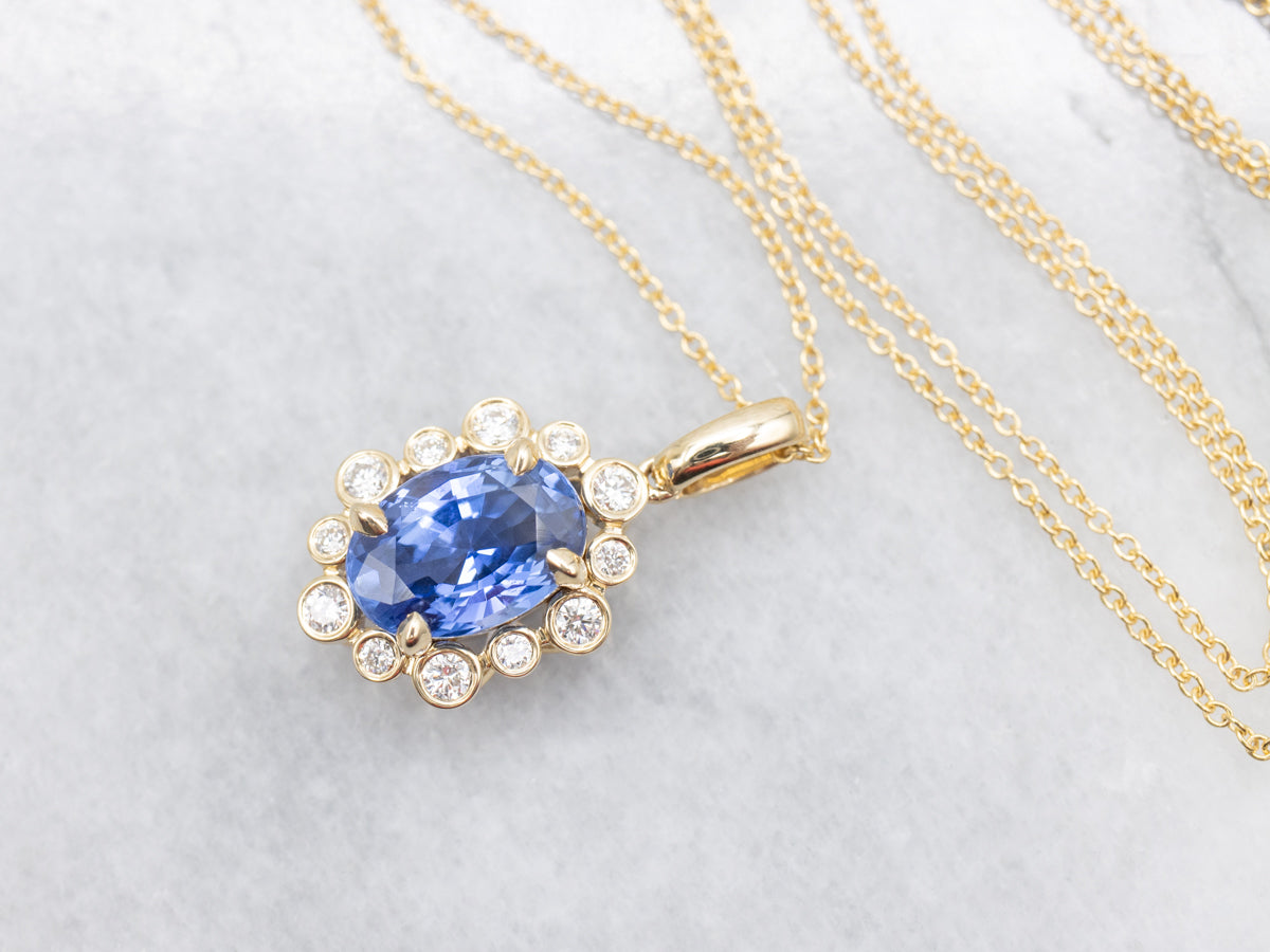 Modern Sapphire and Diamond Halo Pendant Necklace