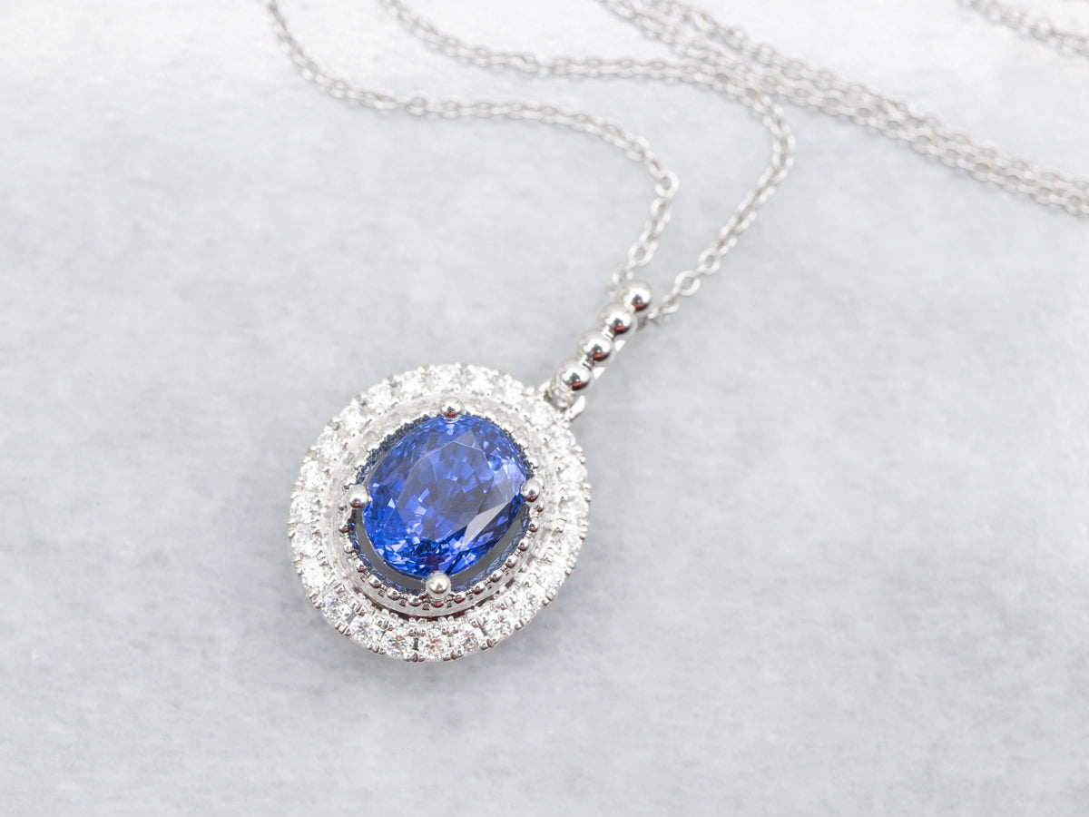 Modern Sapphire and Diamond Halo Pendant Necklace
