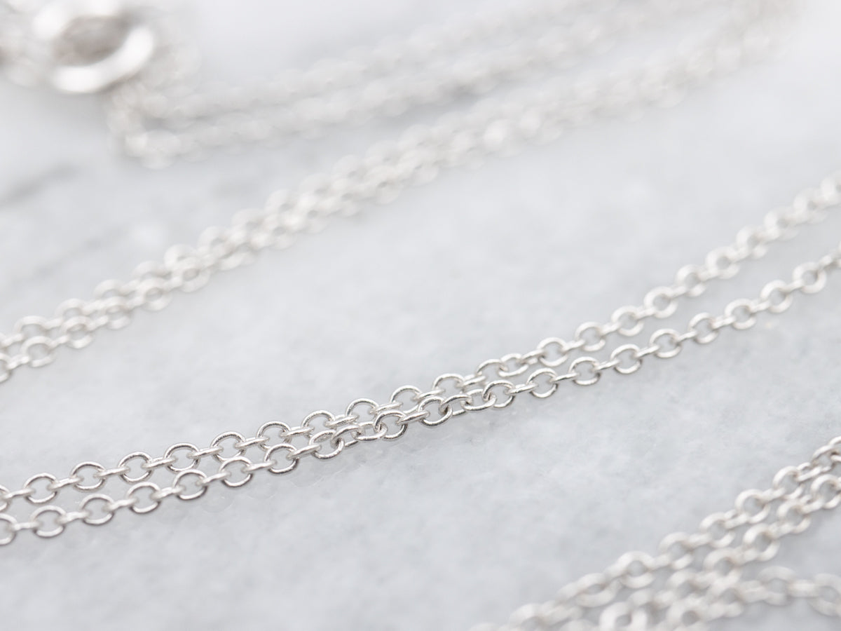 Modern Sapphire and Diamond Halo Pendant Necklace