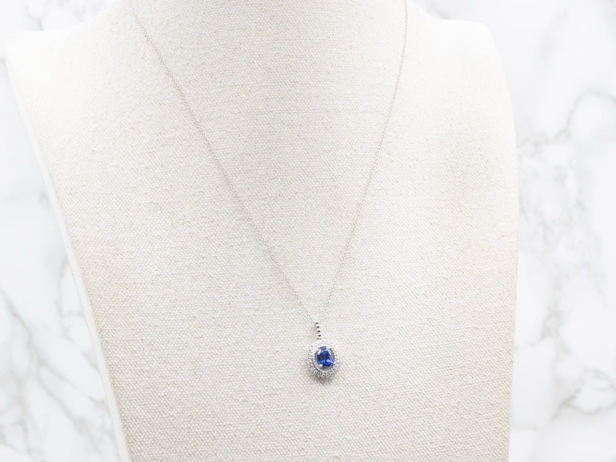 Modern Sapphire and Diamond Halo Pendant Necklace