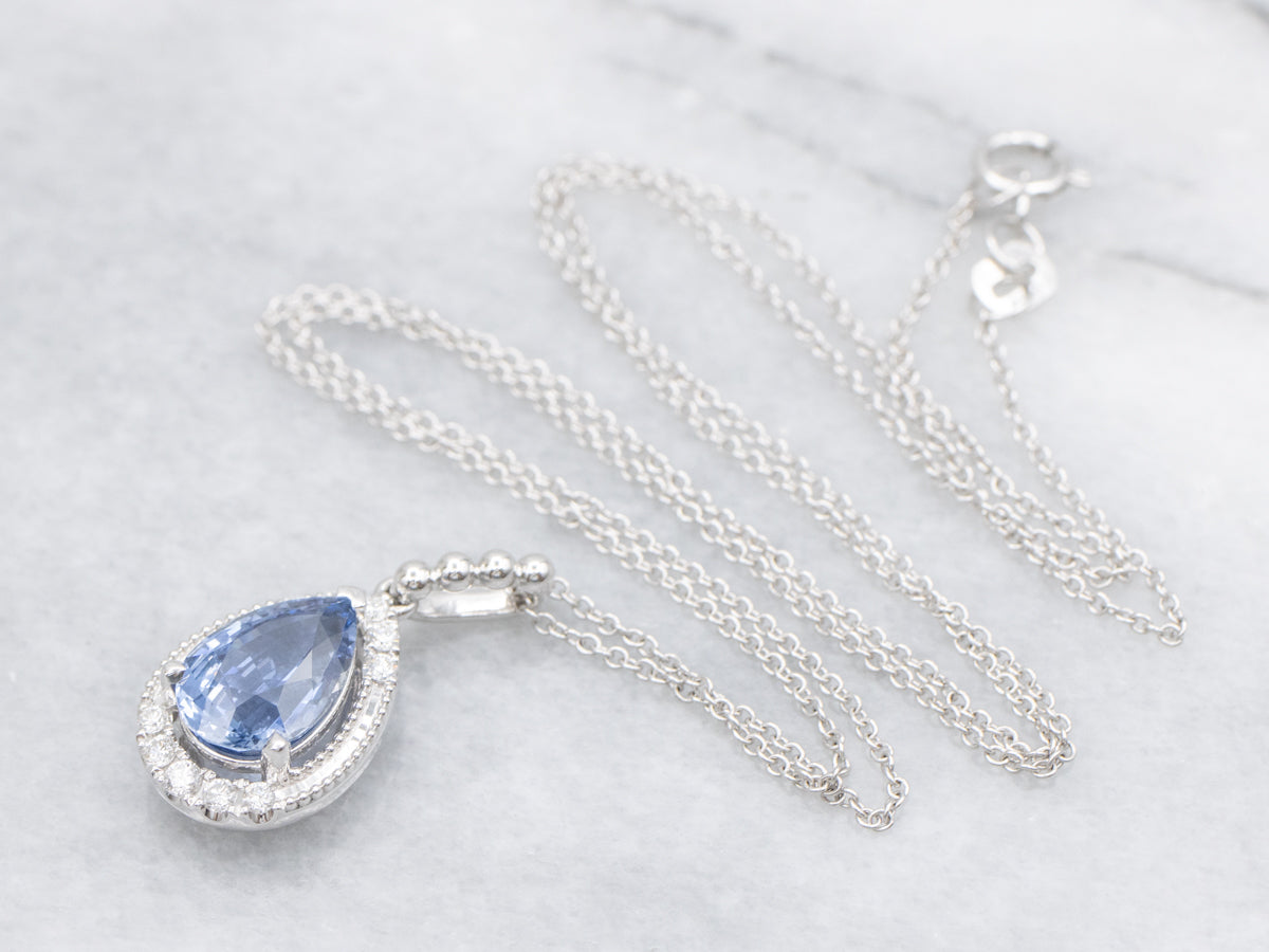Modern Pear-Cut Sapphire and Diamond Halo Pendant Necklace