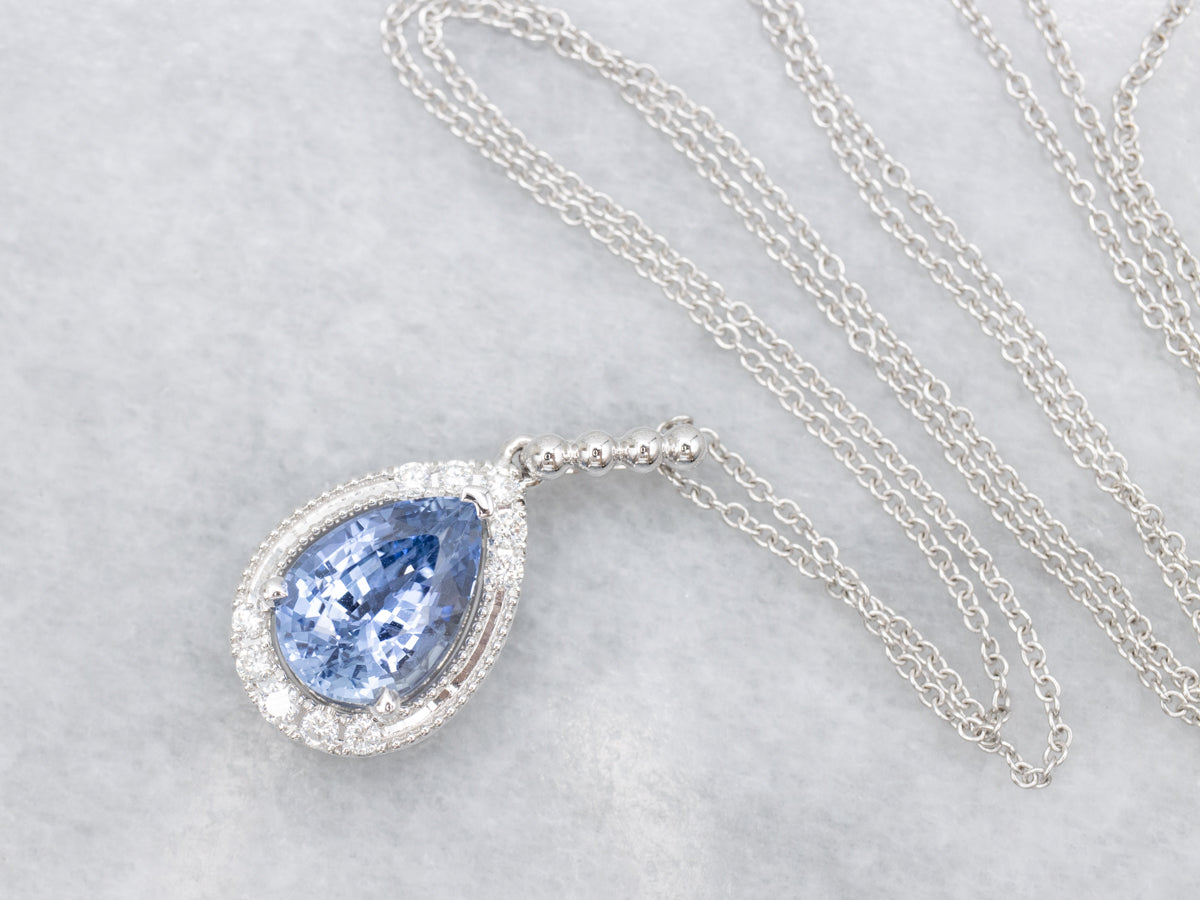 Modern Pear-Cut Sapphire and Diamond Halo Pendant Necklace