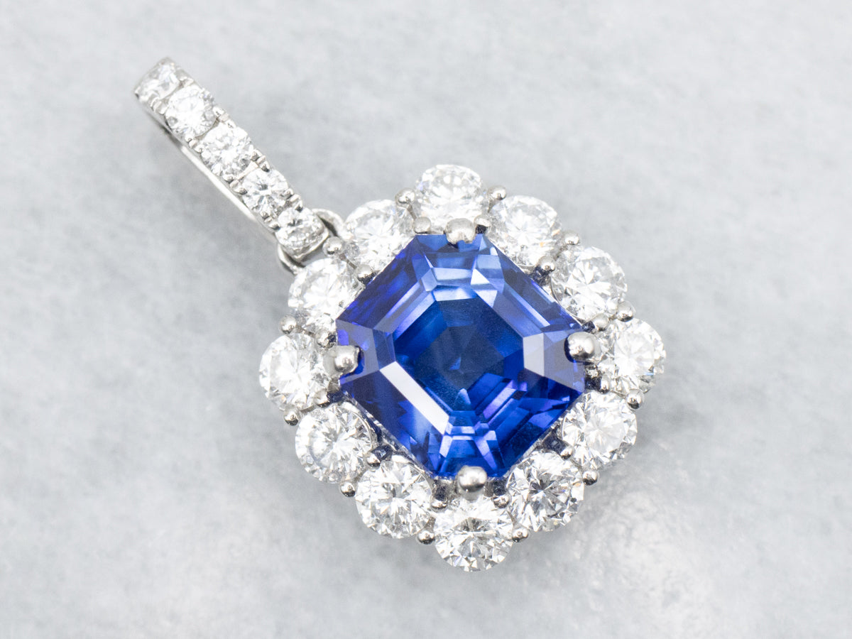 Stunning Platinum Sapphire Pendant with Accented Halo Diamonds