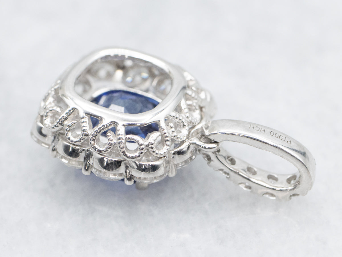Stunning Platinum Sapphire Pendant with Accented Halo Diamonds