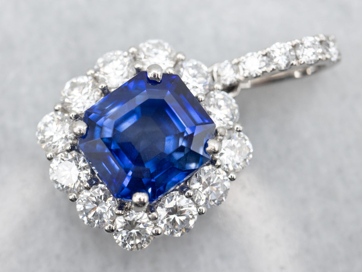 Stunning Platinum Sapphire Pendant with Accented Halo Diamonds