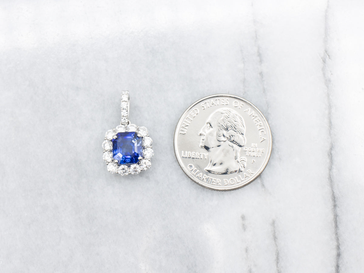 Stunning Platinum Sapphire Pendant with Accented Halo Diamonds