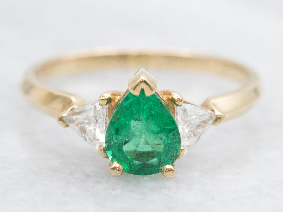 Modern Emerald and Trillion Cut Diamond Accent Ring