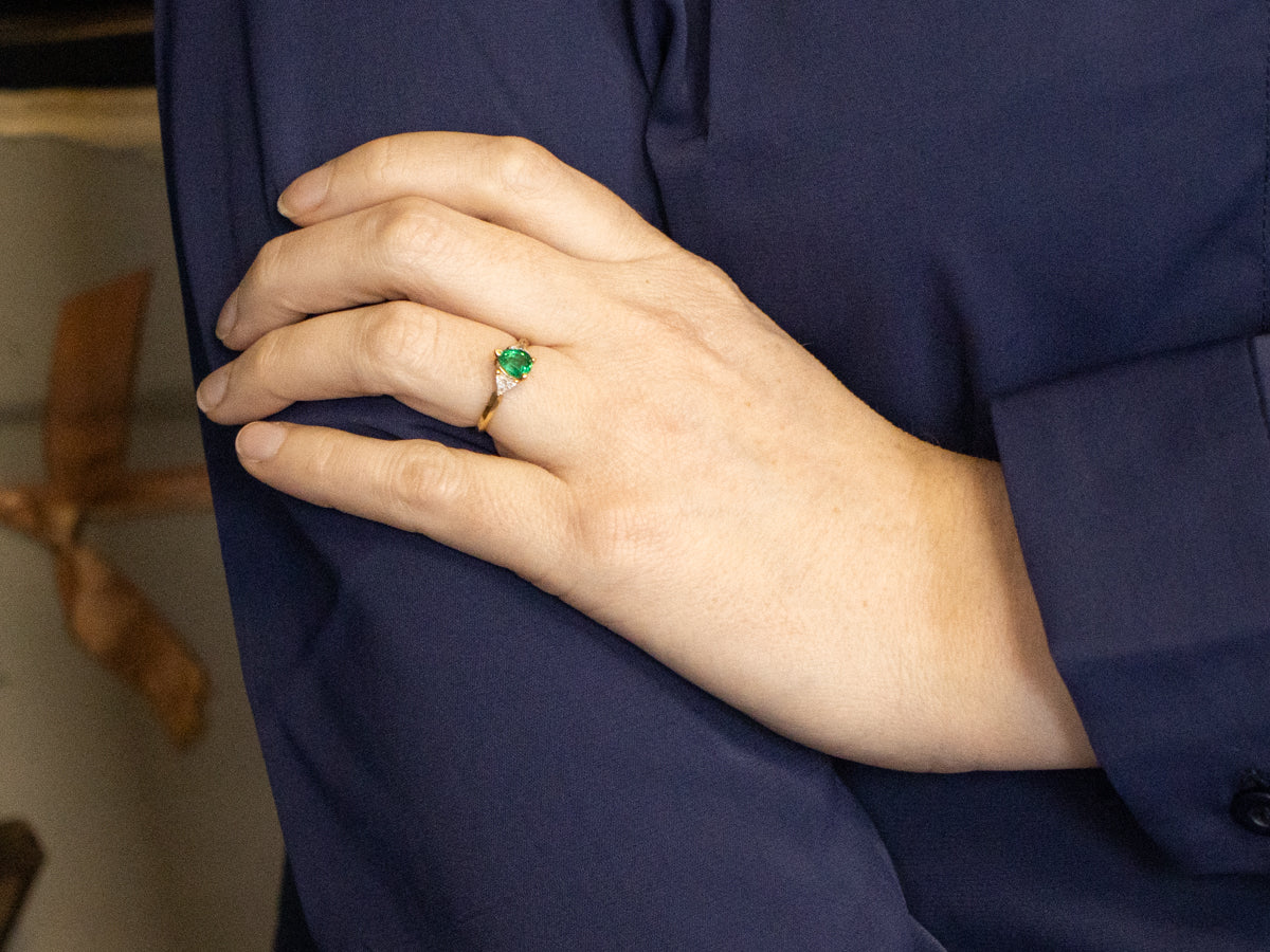 Modern Emerald and Trillion Cut Diamond Accent Ring