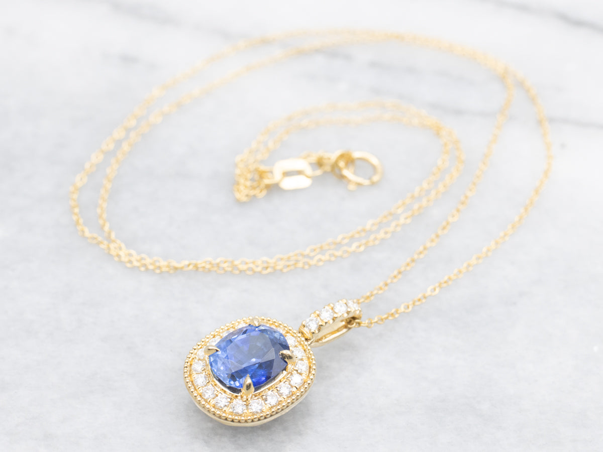 Modern Sapphire and Diamond Halo Pendant on Cable Chain