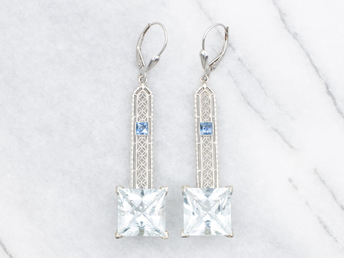 Pendientes colgantes de aguamarina en oro blanco con detalles de zafiro
