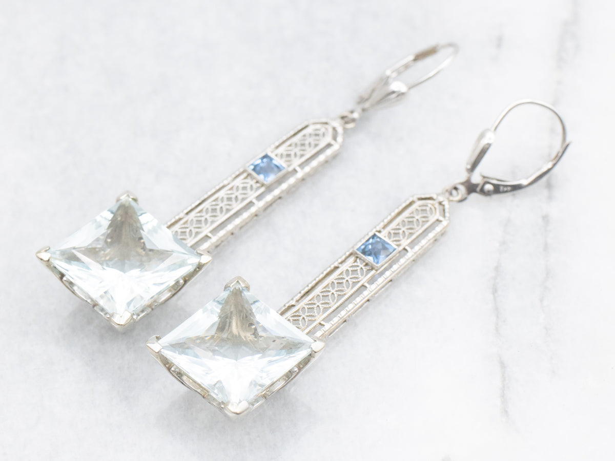 Pendientes colgantes de aguamarina en oro blanco con detalles de zafiro