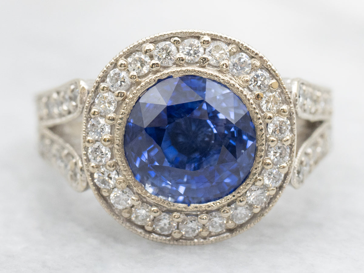 Bold Blue Sapphire and Diamond Encrusted Halo Ring