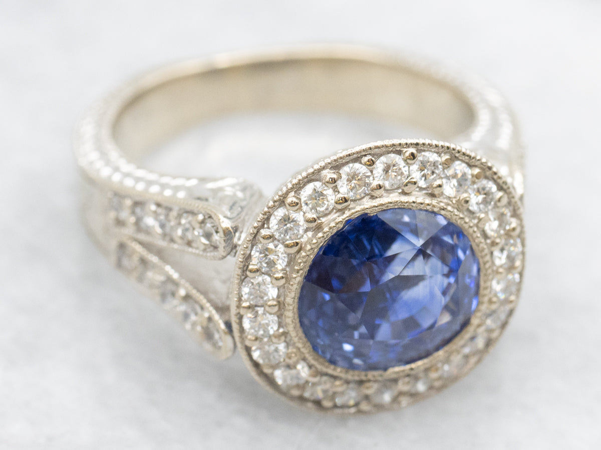 Bold Blue Sapphire and Diamond Encrusted Halo Ring