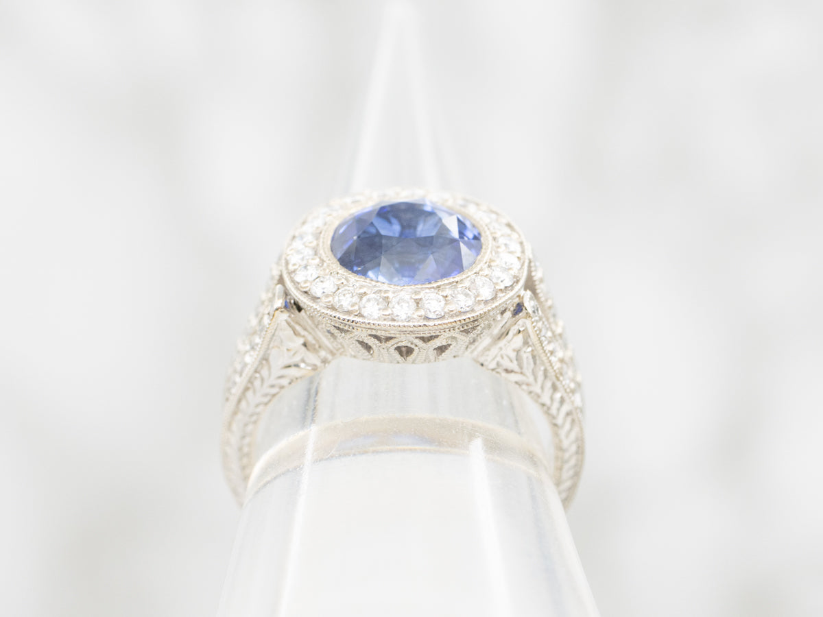 Bold Blue Sapphire and Diamond Encrusted Halo Ring