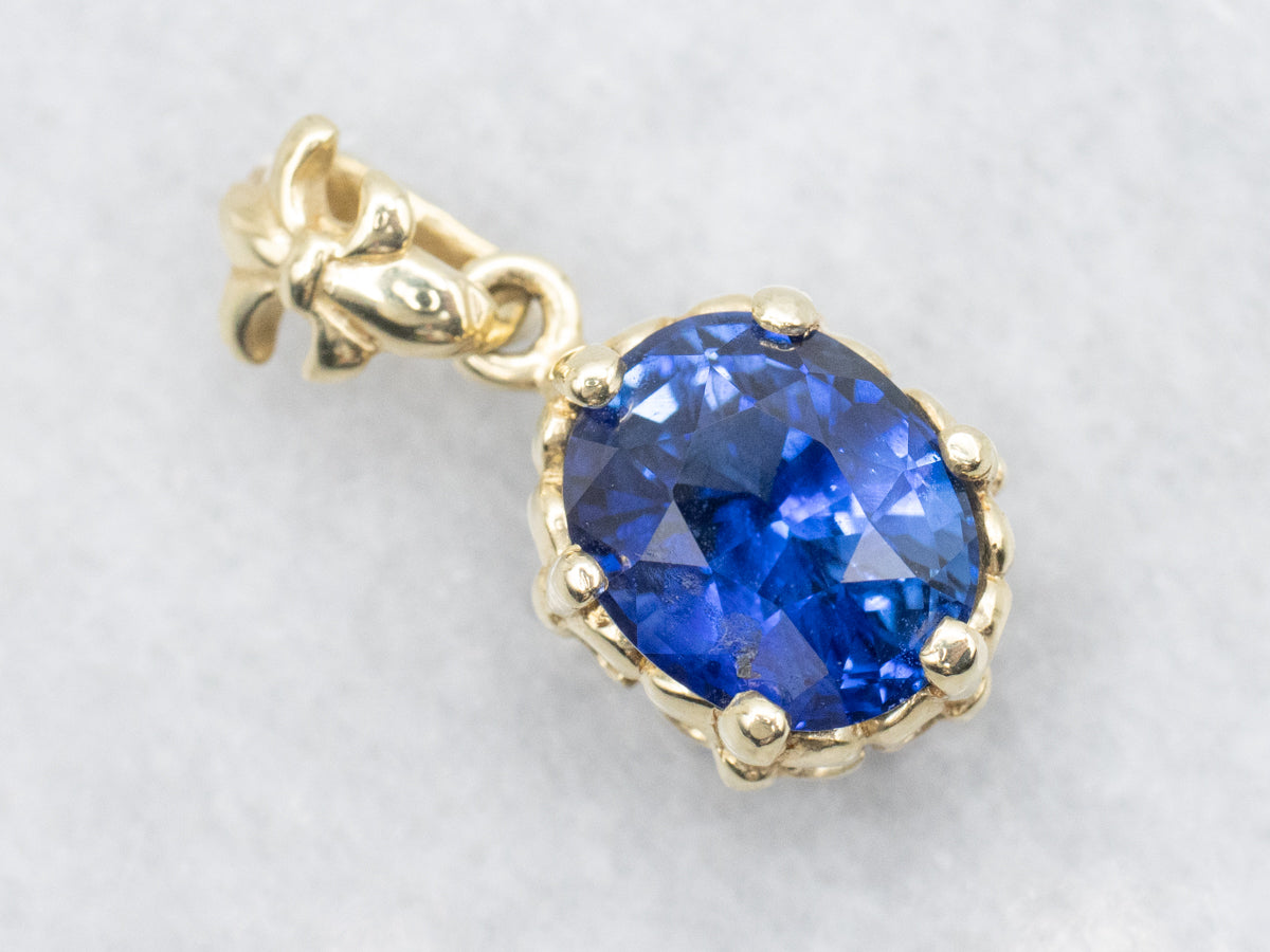 Fleur De Lis Blue Sapphire Solitaire Pendant