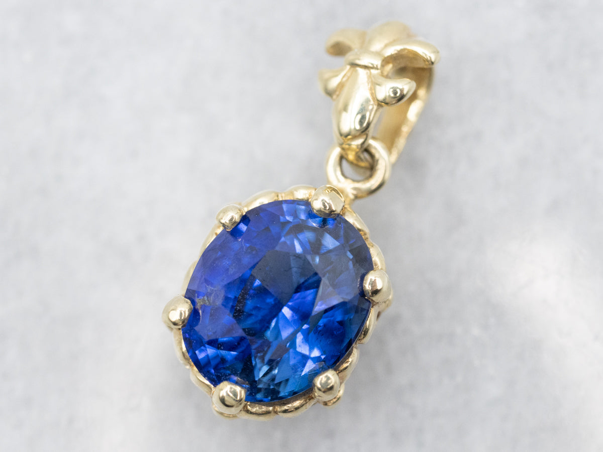 Fleur De Lis Blue Sapphire Solitaire Pendant