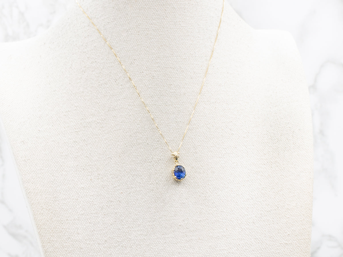 Fleur De Lis Blue Sapphire Solitaire Pendant