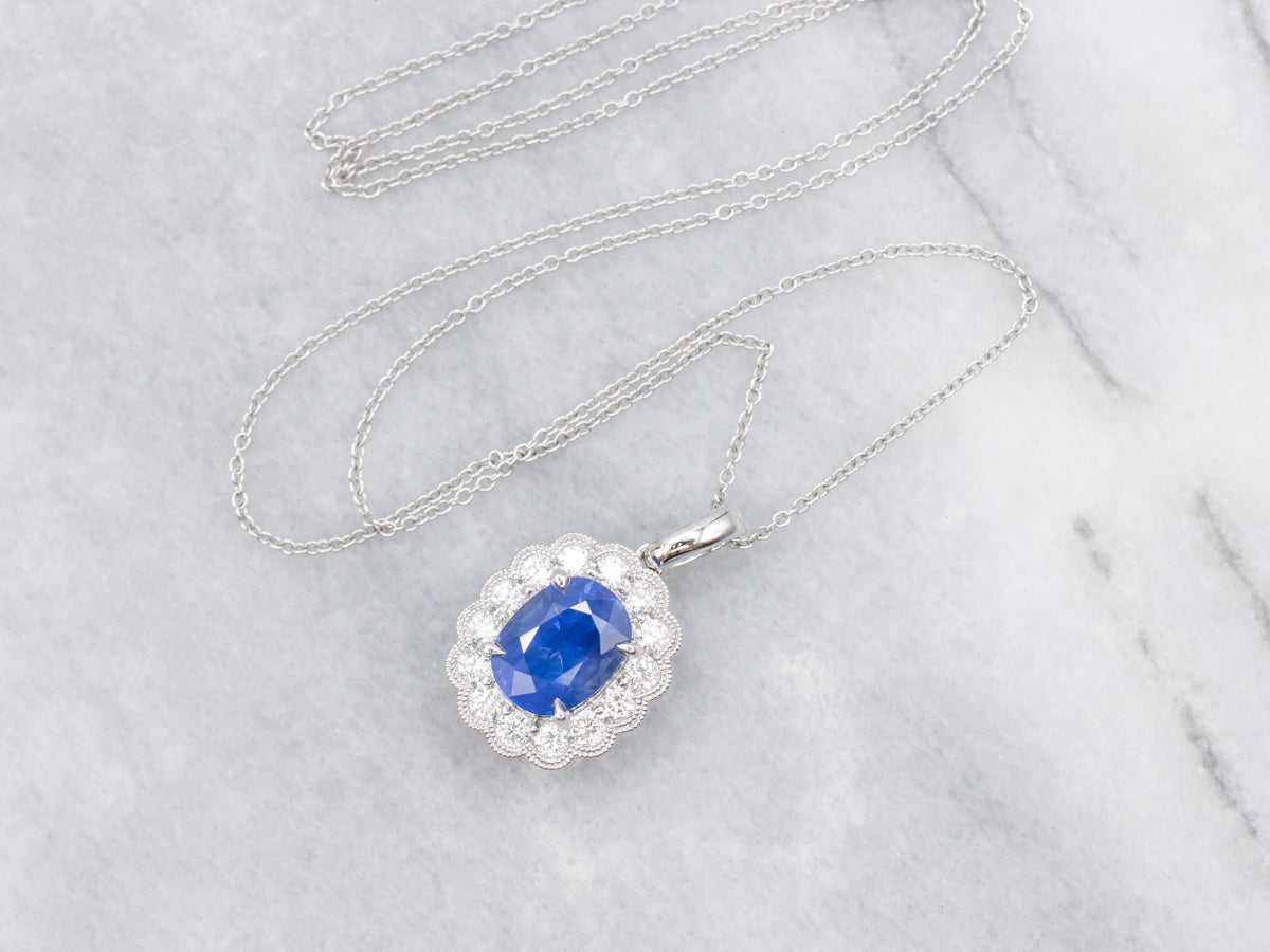 Modern Sapphire and Diamond Halo Pendant on Cable Chain