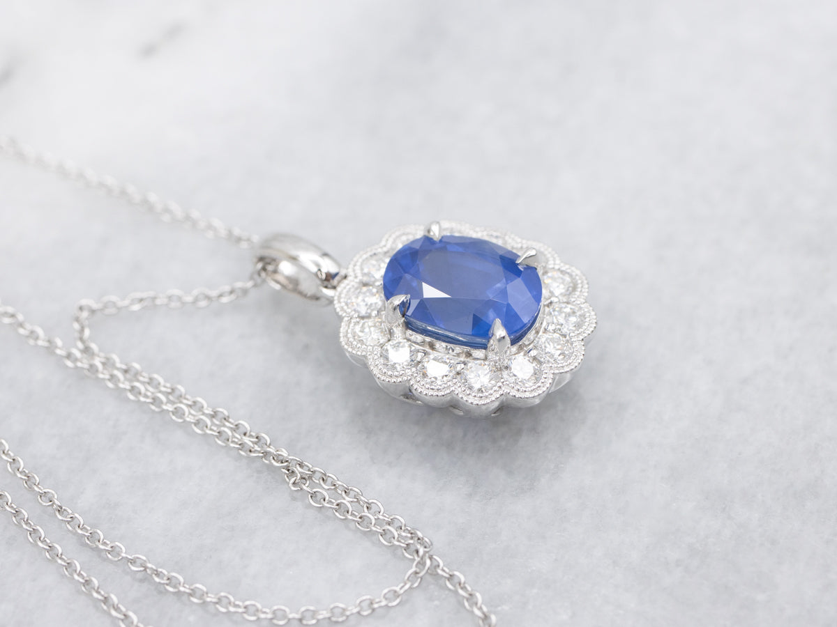 Modern Sapphire and Diamond Halo Pendant on Cable Chain