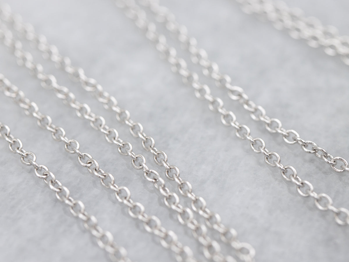 Modern Sapphire and Diamond Halo Pendant on Cable Chain