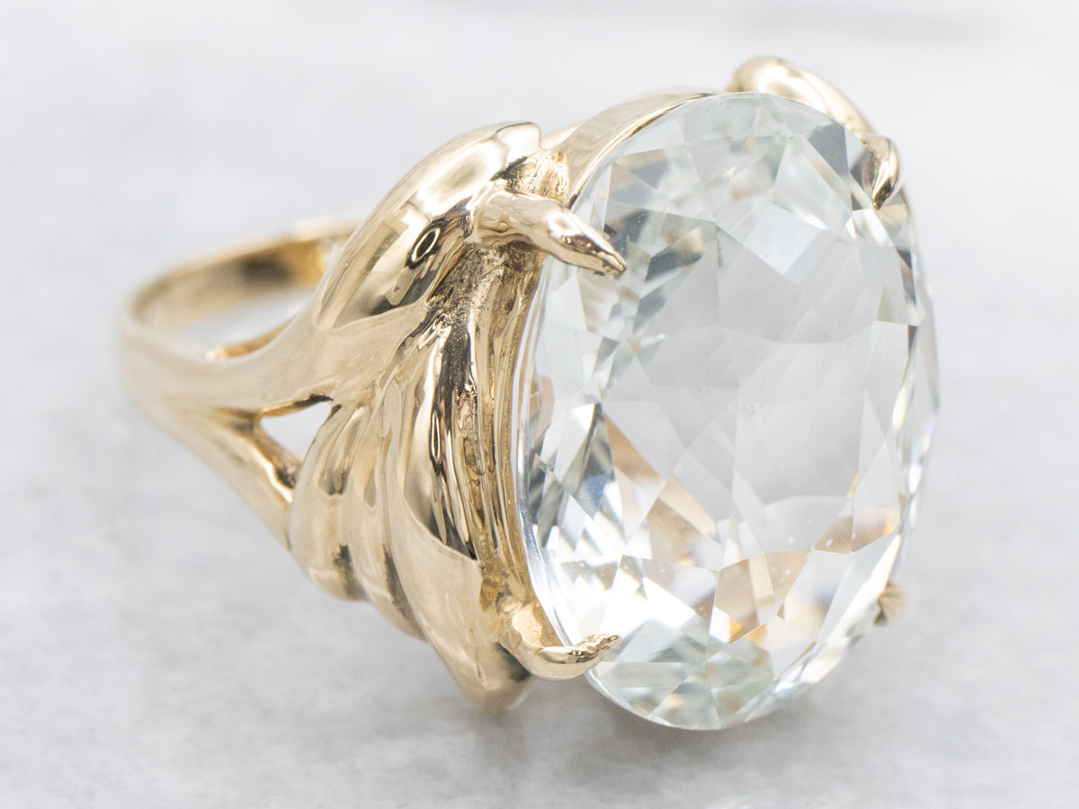 Anillo de cóctel con solitario ovalado de aguamarina grande de oro amarillo de 14 quilates