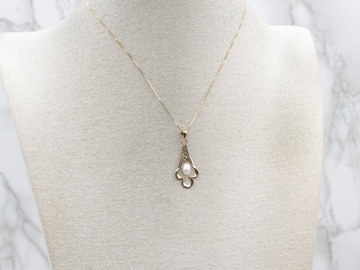 Engraved Gold Spade-Shaped Pendant with Swinging Freshwater Pearl Center