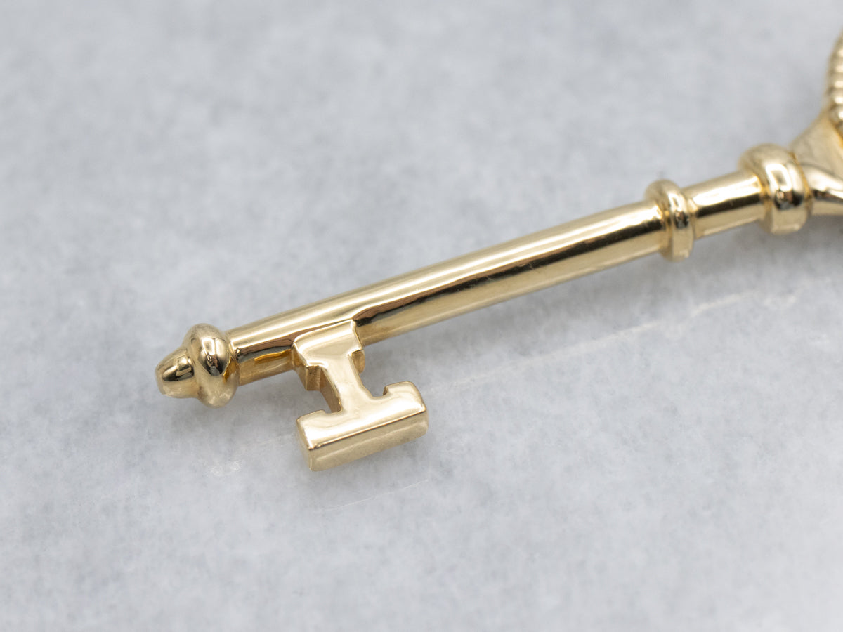 Tiffany & Co. 18K Yellow Gold Bezel Set Diamond  Daisy Key Pendant