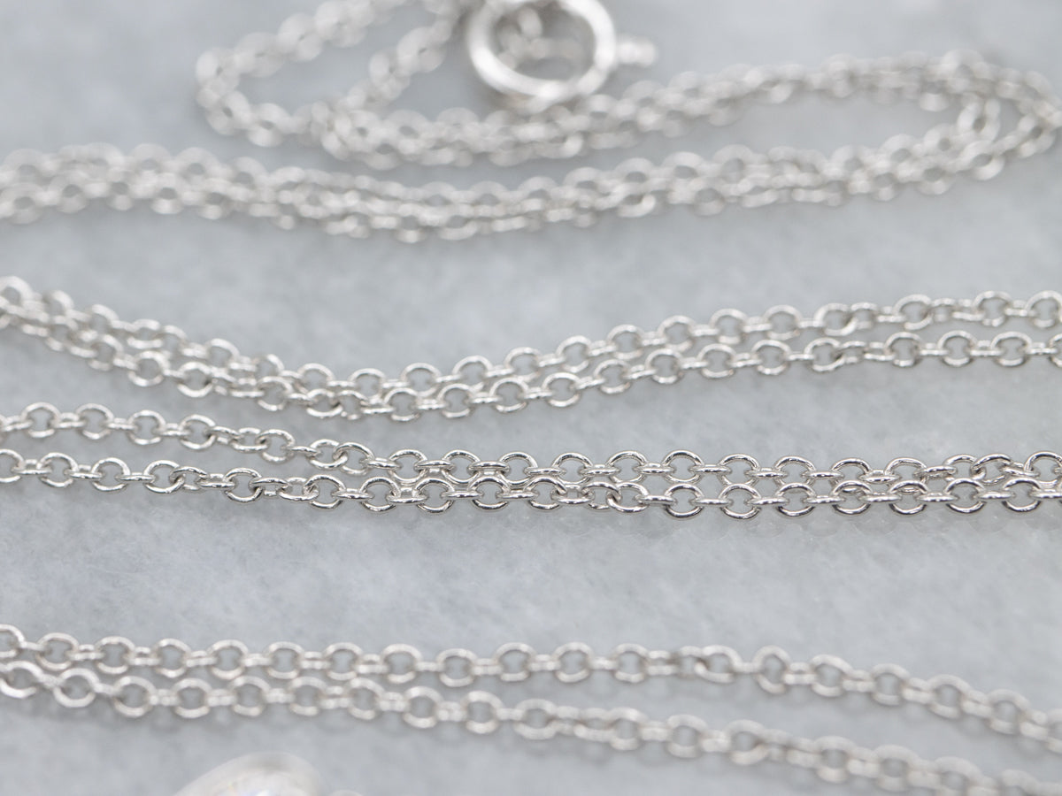 Modern Ruby and Teardrop Diamond Halo Pendant Necklace