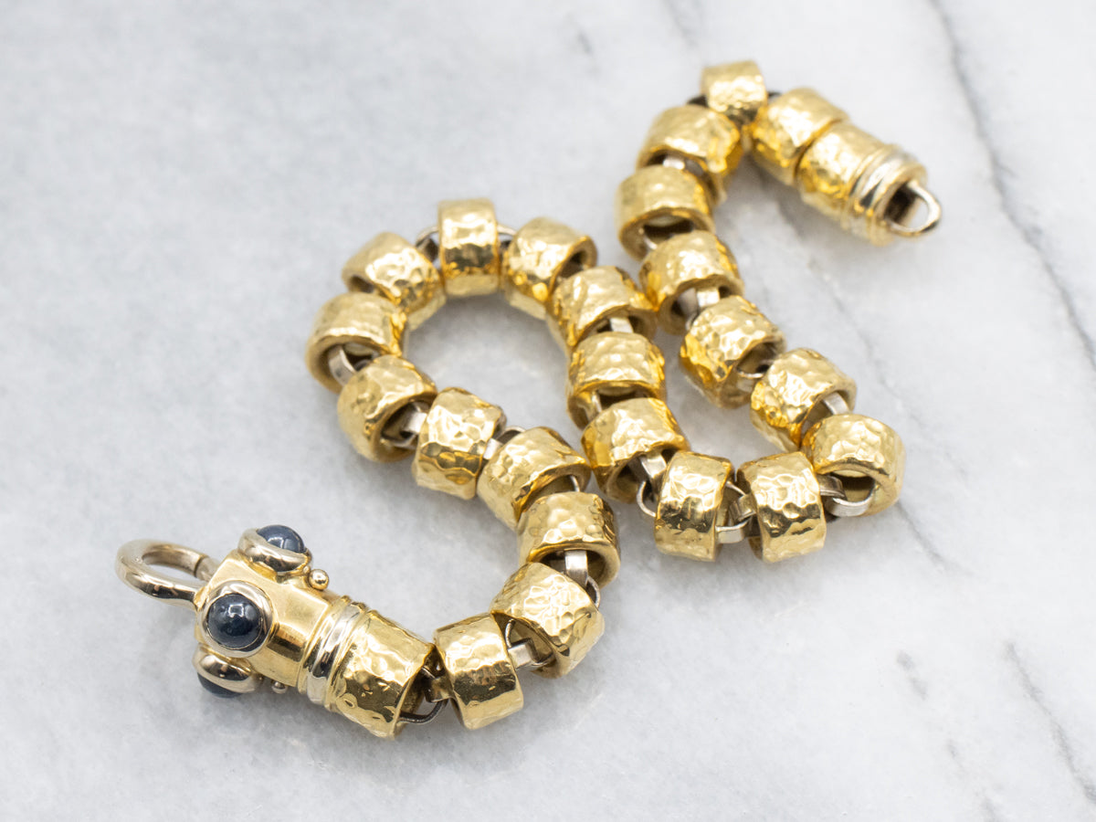 18-Karat Gold Bracelet with Faceted Links and Decorative Sapphire Cabochon Clasp