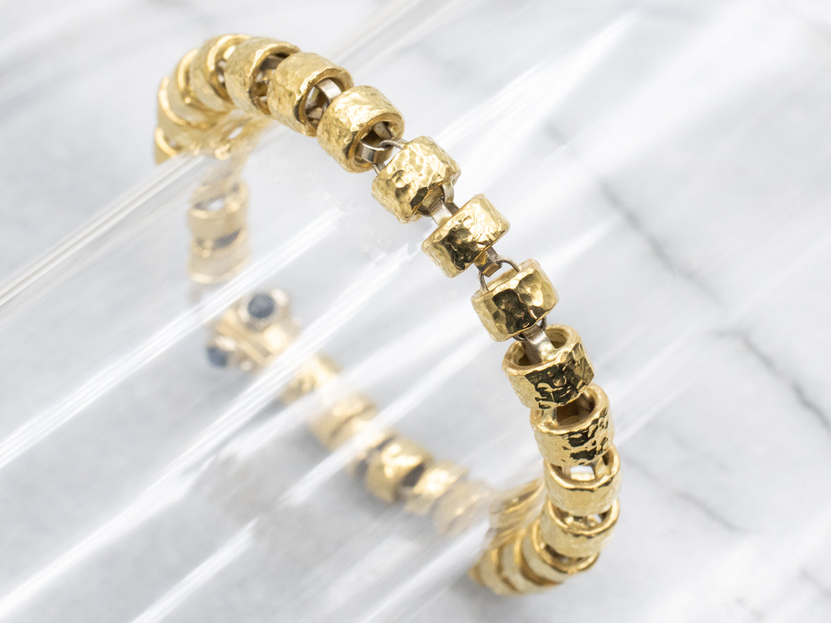 18-Karat Gold Bracelet with Faceted Links and Decorative Sapphire Cabochon Clasp