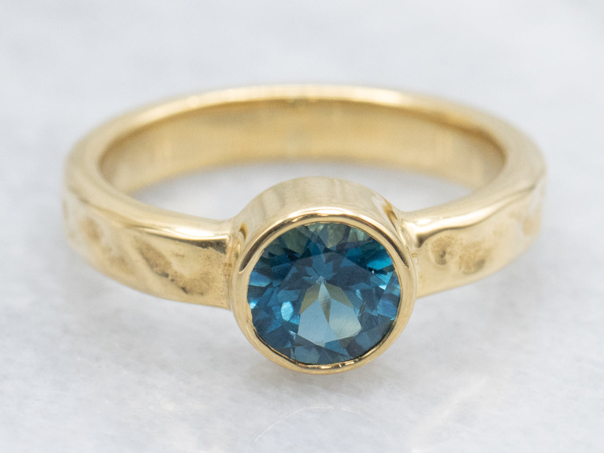 Bezel-Set Blue Topaz 18K Gold Solitaire Ring by Koplewitz Designer