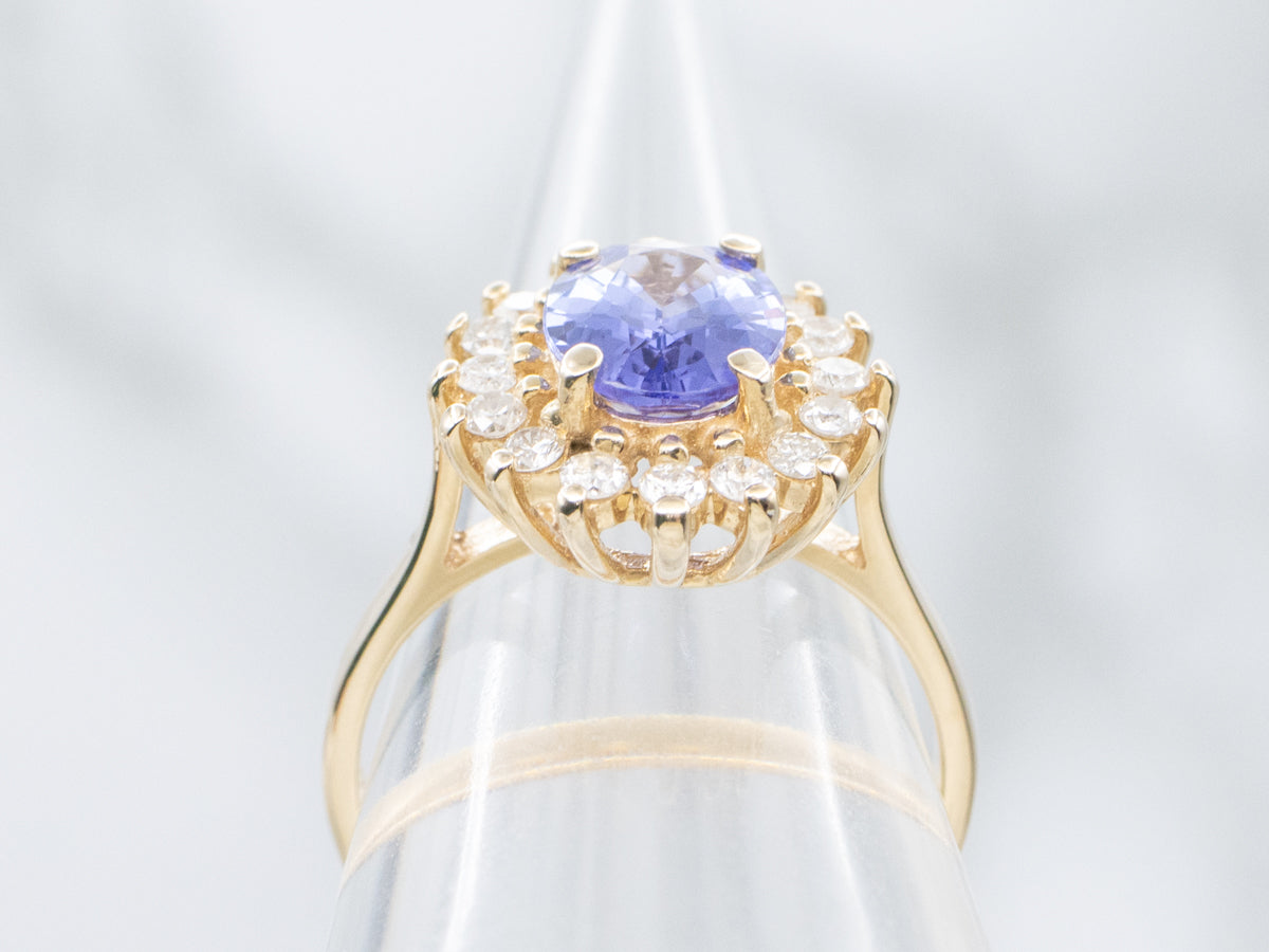 Tanzanite and Diamond Halo Yellow Gold Ring
