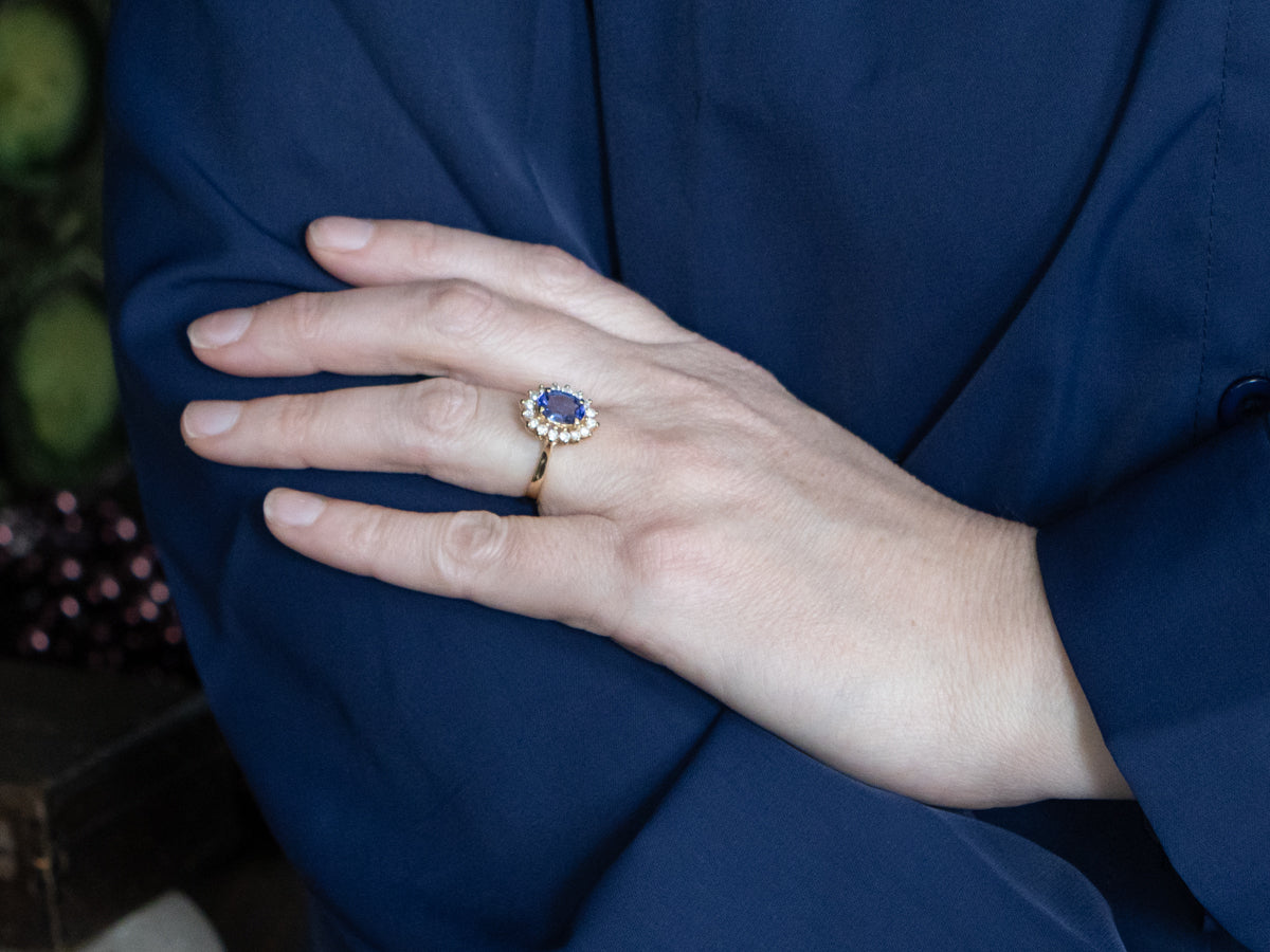 Tanzanite and Diamond Halo Yellow Gold Ring