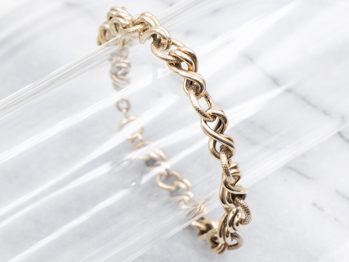 Antique Gold Textured and Twisting Link Bracelet