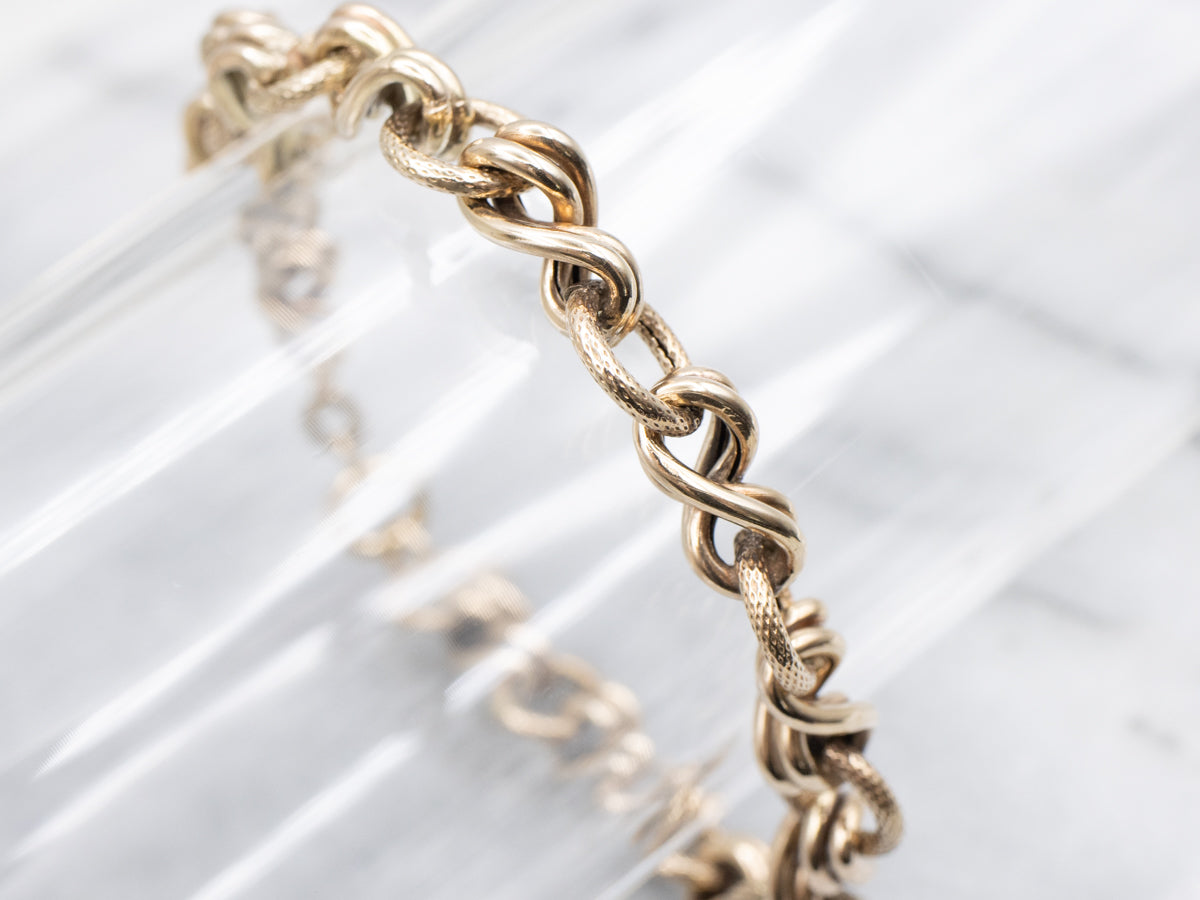 Antique Gold Textured and Twisting Link Bracelet
