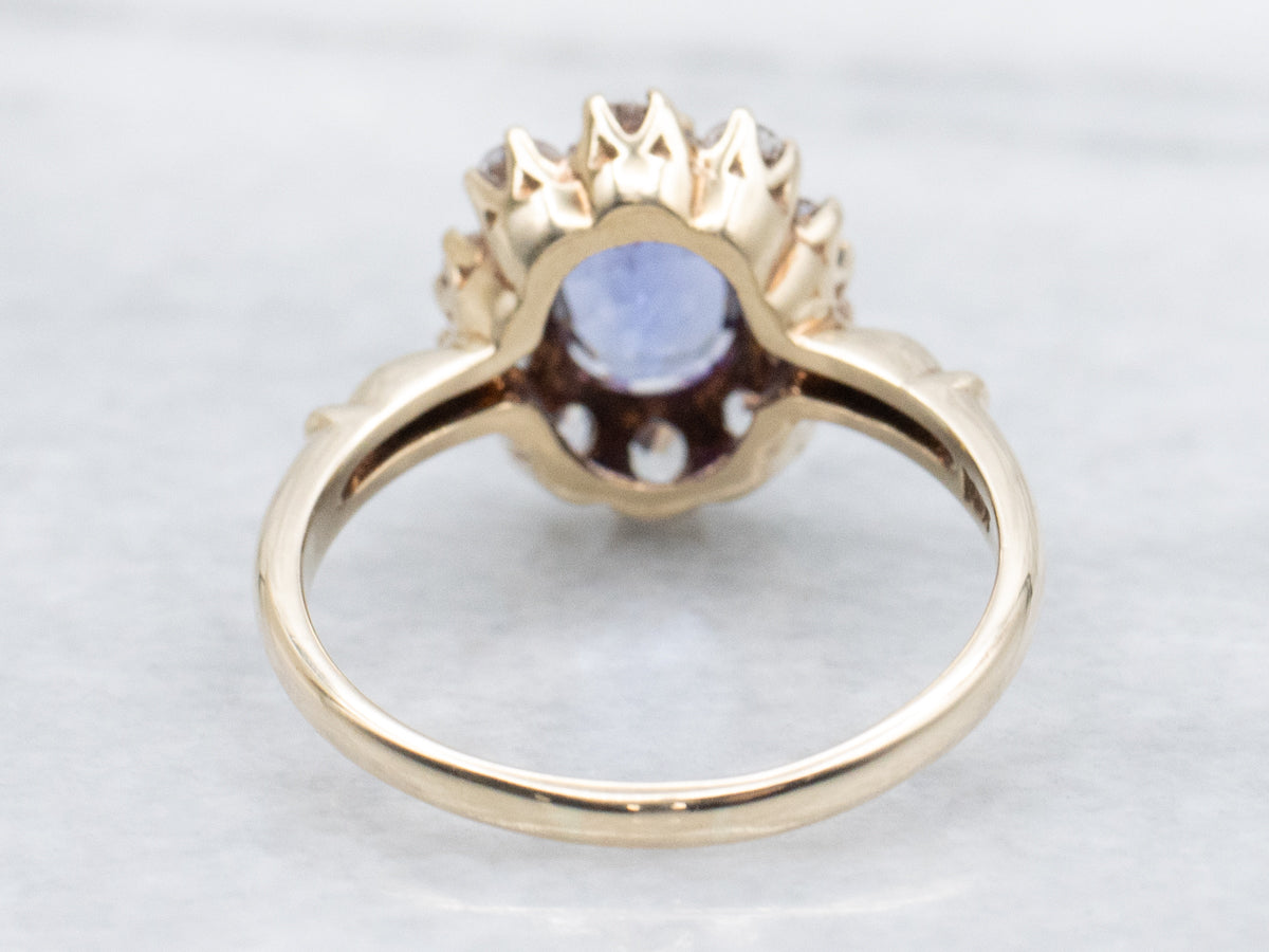 Vintage Tanzanite and Gold White Topaz Halo Ring
