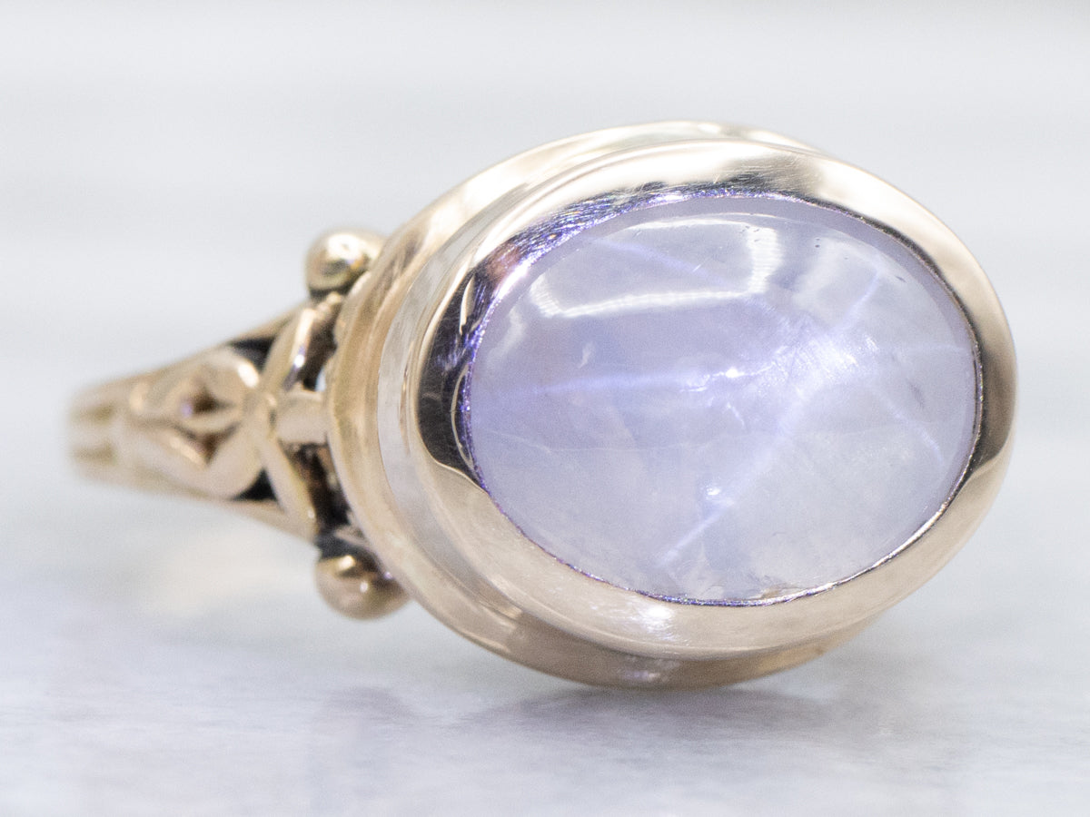 Floral East-to-West Bezel-Set Star Sapphire Gold Solitaire Ring