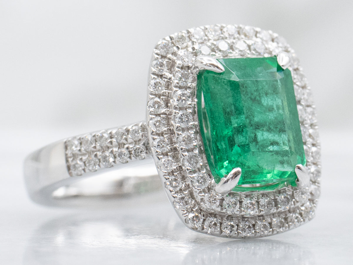 Modern Emerald and Double Diamond Halo White Gold Ring