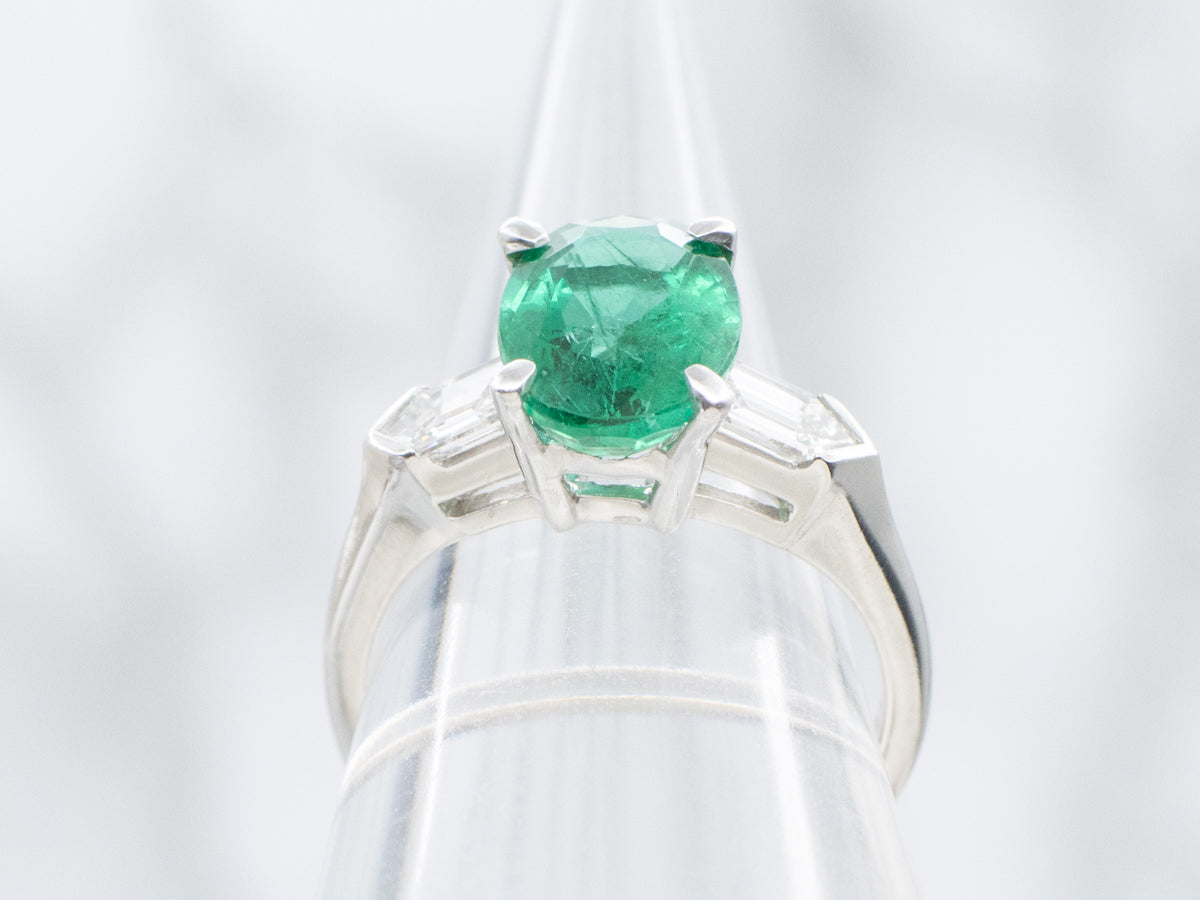 Modern Platinum Emerald Engagement Ring with Fancy-Cut Diamond Accents