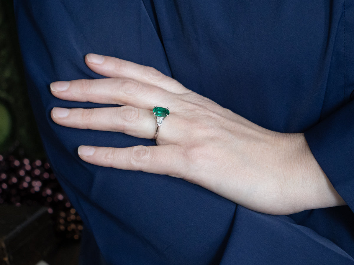Modern Platinum Emerald Engagement Ring with Fancy-Cut Diamond Accents