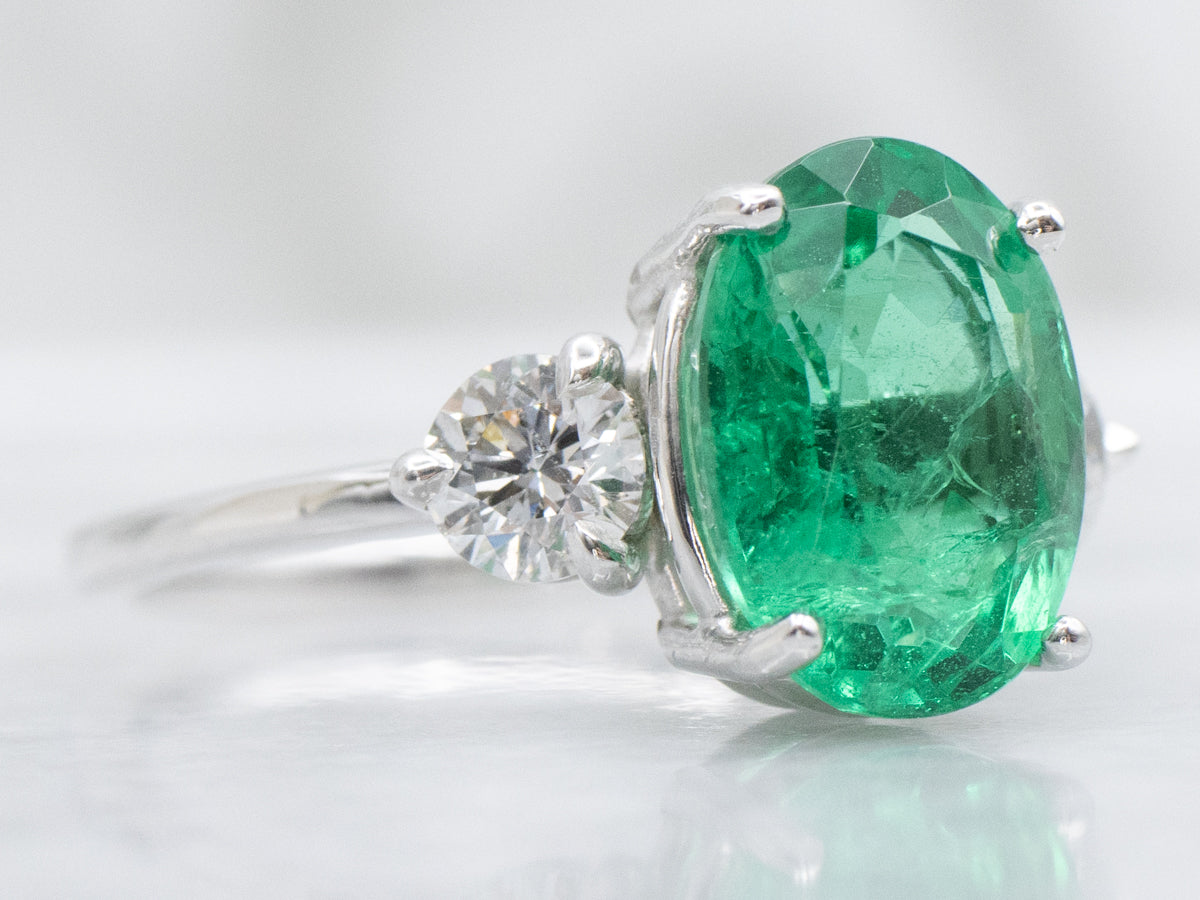 Modern Oval-Cut Emerald and Diamond Three Stone Ring
