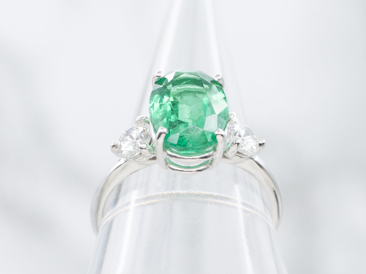 Modern Oval-Cut Emerald and Diamond Three Stone Ring