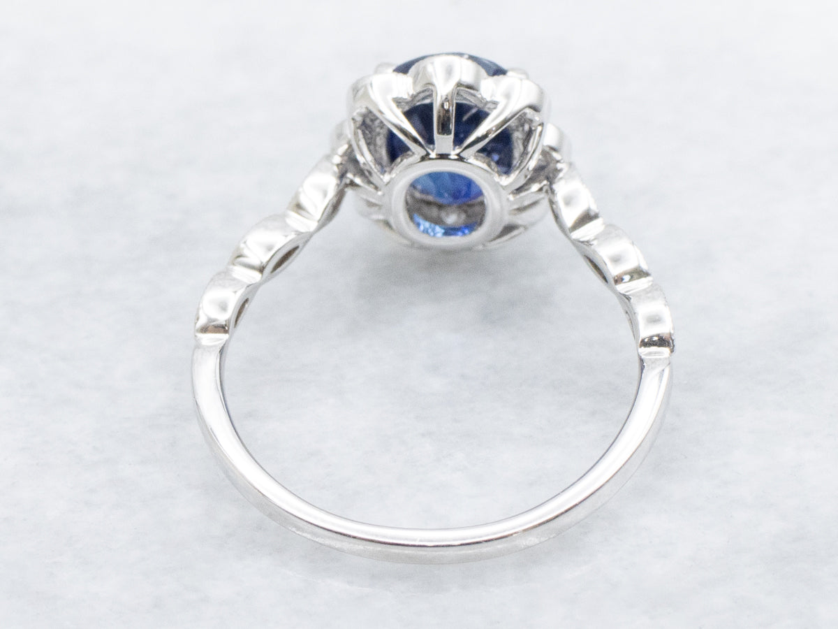Sapphire and Diamond Scalloped Halo Modern Ring