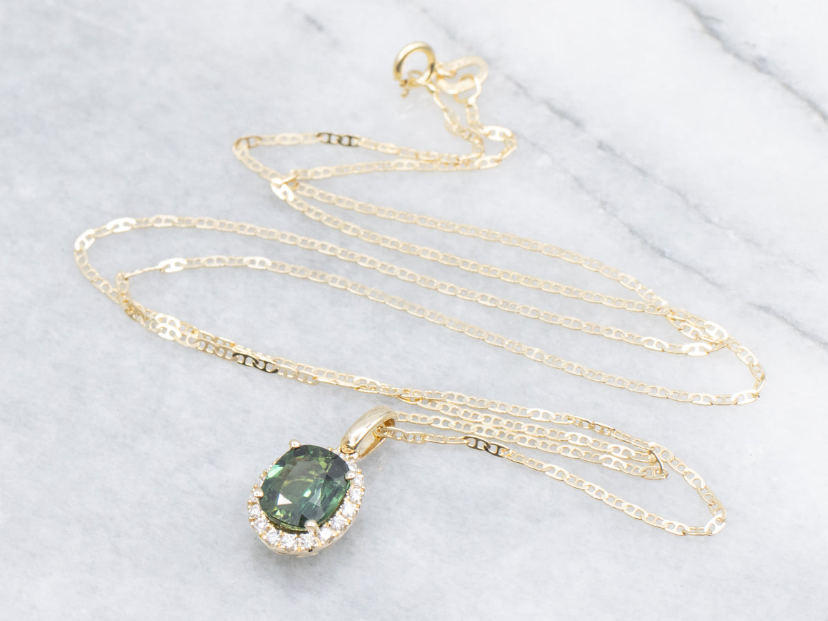 Blue-Green Sapphire and Diamond Halo Gold Pendant Necklace