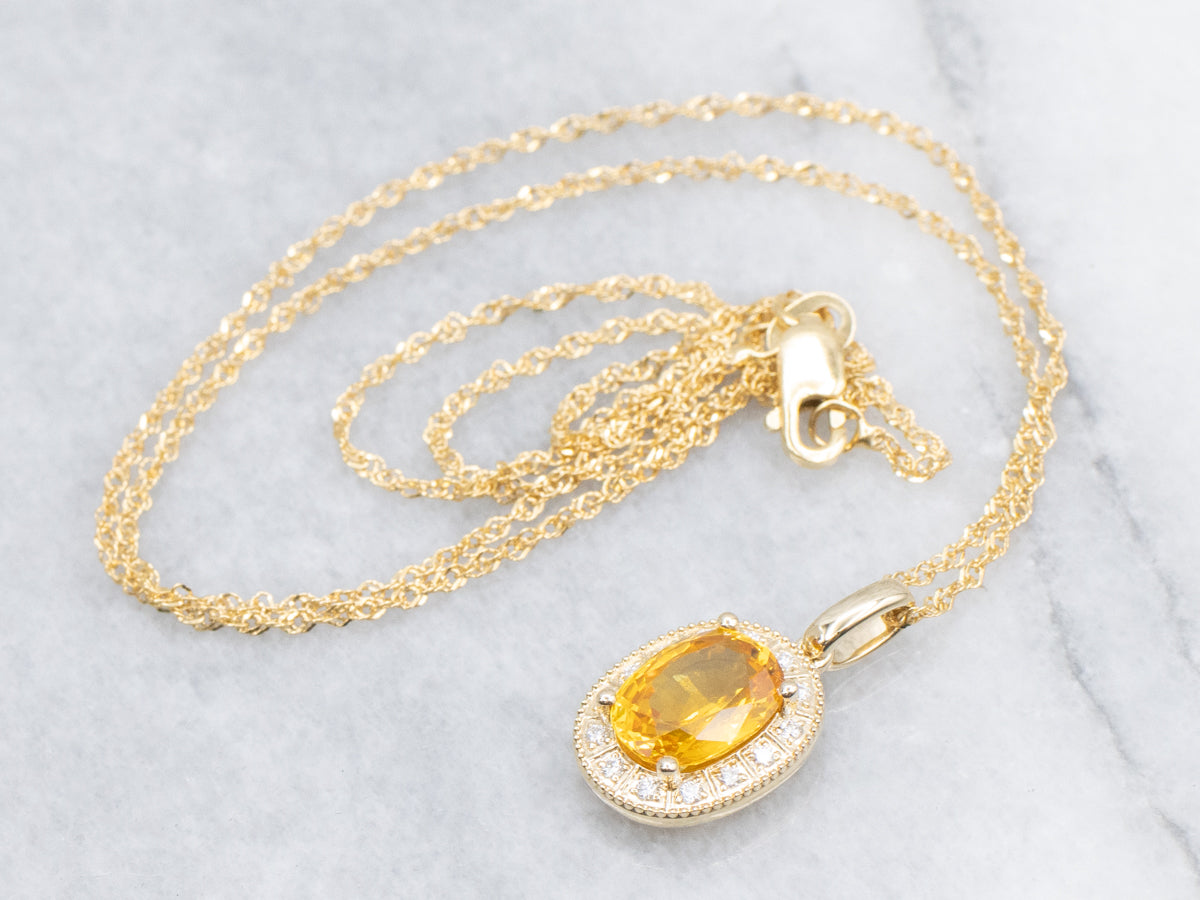 Modern Yellow Sapphire and Diamond Halo Pendant Necklace