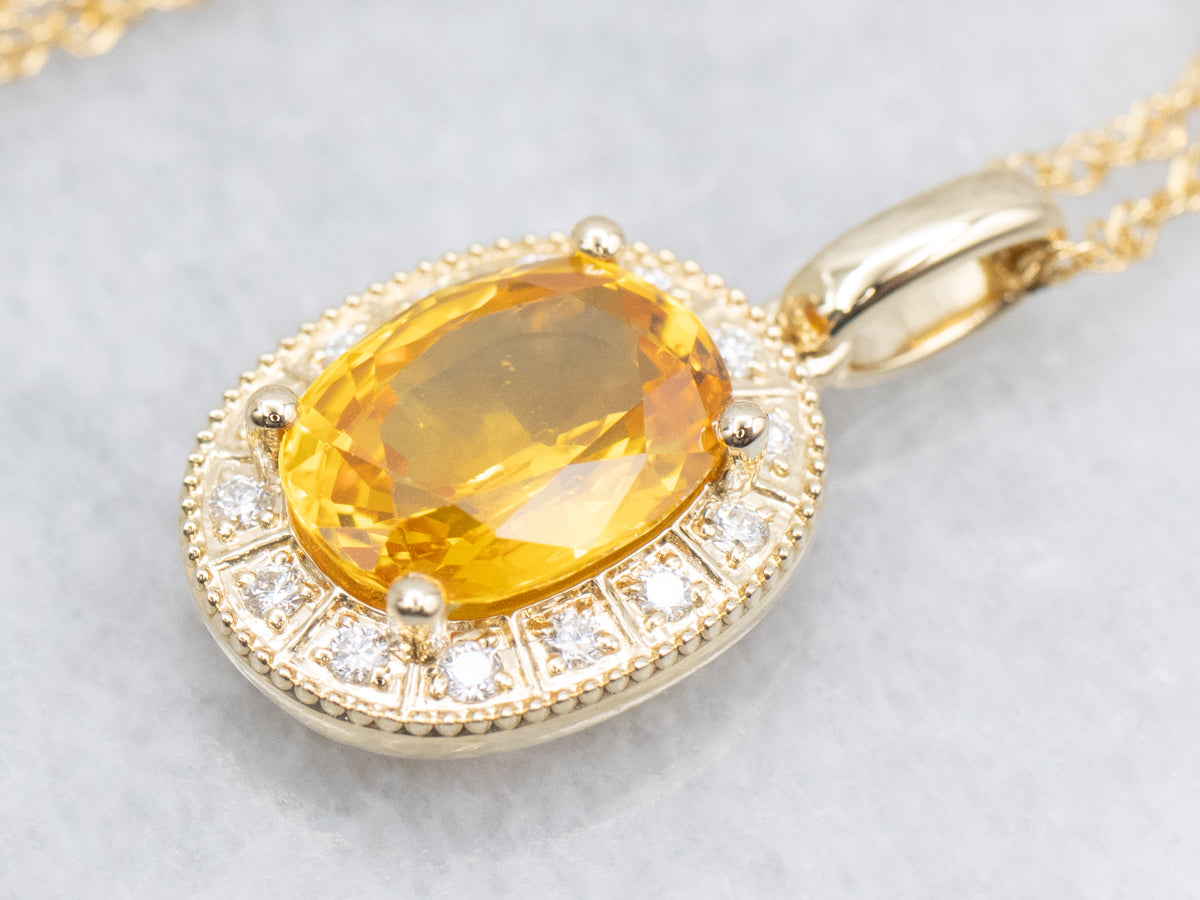 Modern Yellow Sapphire and Diamond Halo Pendant Necklace