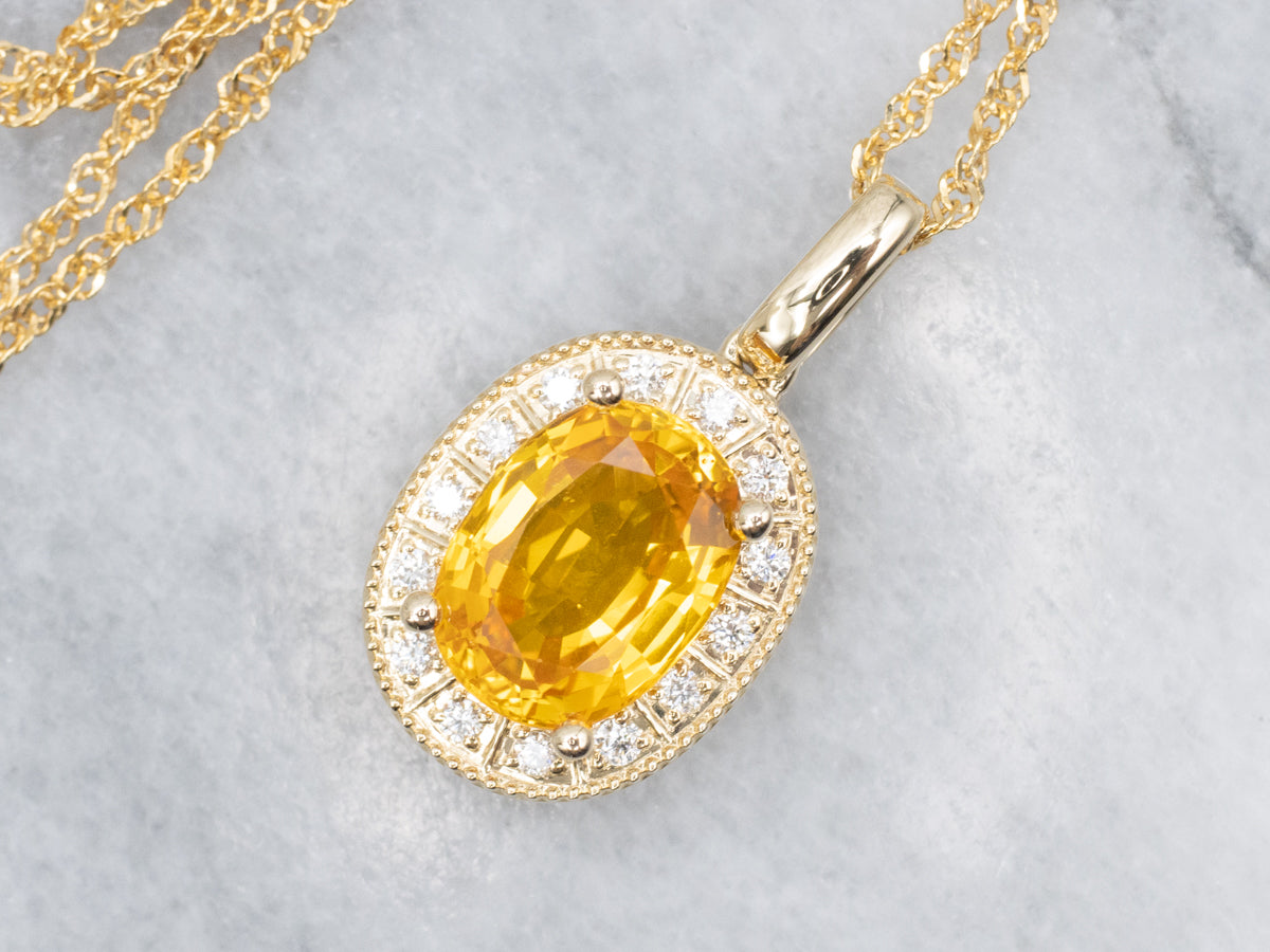 Modern Yellow Sapphire and Diamond Halo Pendant Necklace