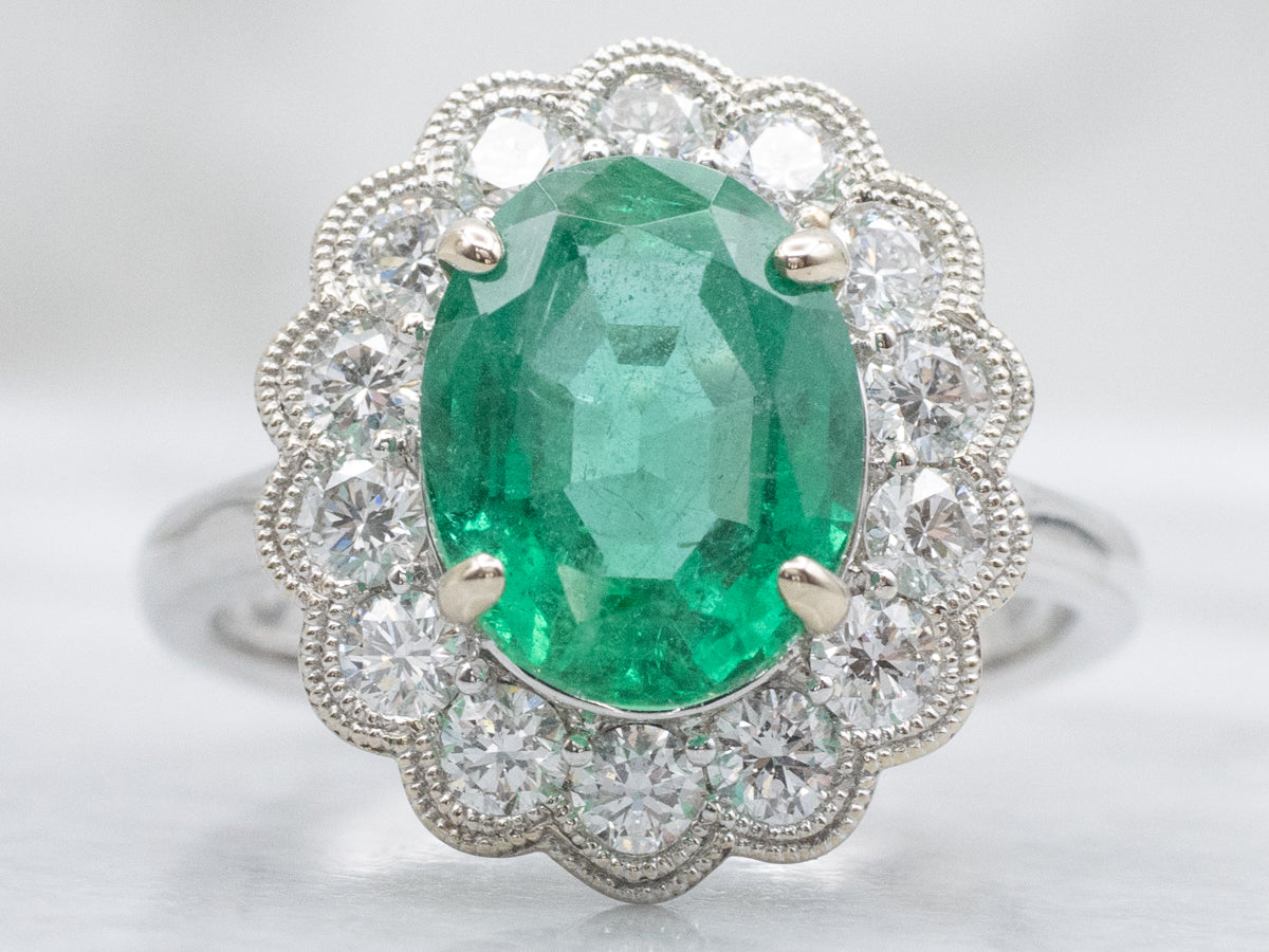 Scallop-Gold Emerald and Diamond Halo Ring